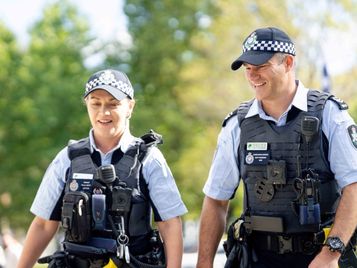 Two ACT Policing officers walking outside