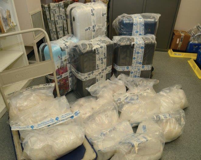 Suitcases and clear packaging containing crystal methamphetamine