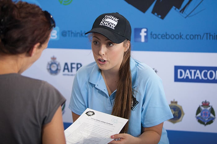 An AFP ThinkUKnow member speaking with member of the public