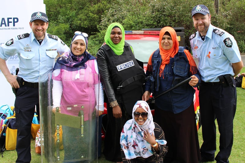 Two police officers with four women