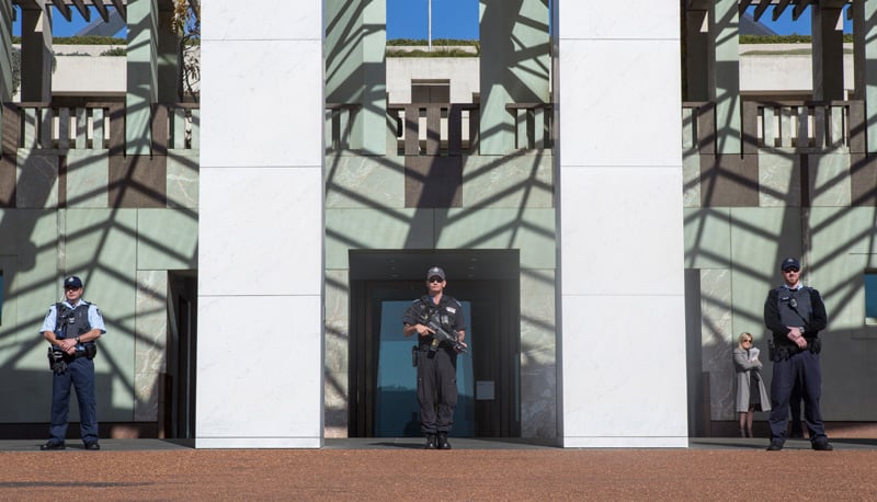 Three police officers outside Parliament House
