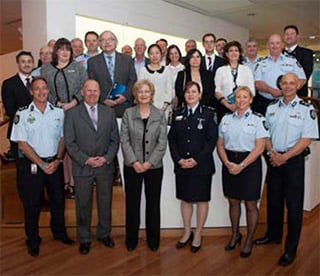 A group photo of over 20 AFP executive and employees (some in uniform and some in civilian dress). 