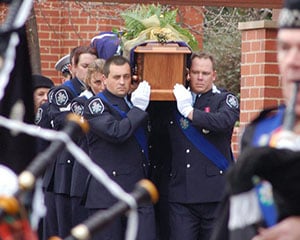 AFP officers carrying a casket