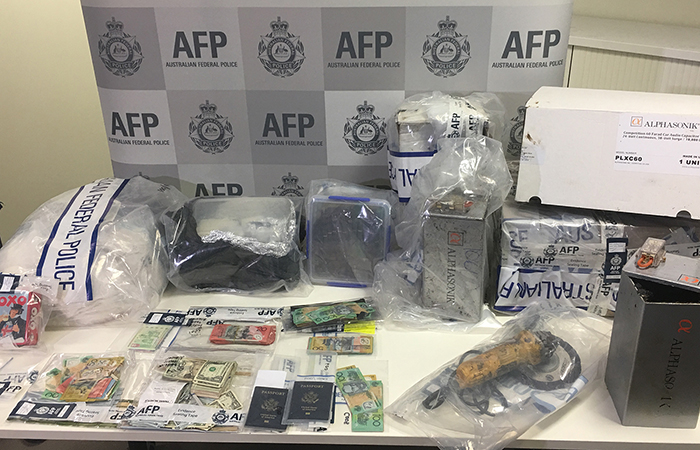 A table with numerous items seized by police
