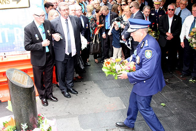 NSW Police – who lost member Paul Burmistriw in the bombing – lay a wreath at the memorial to the victims of the incident.