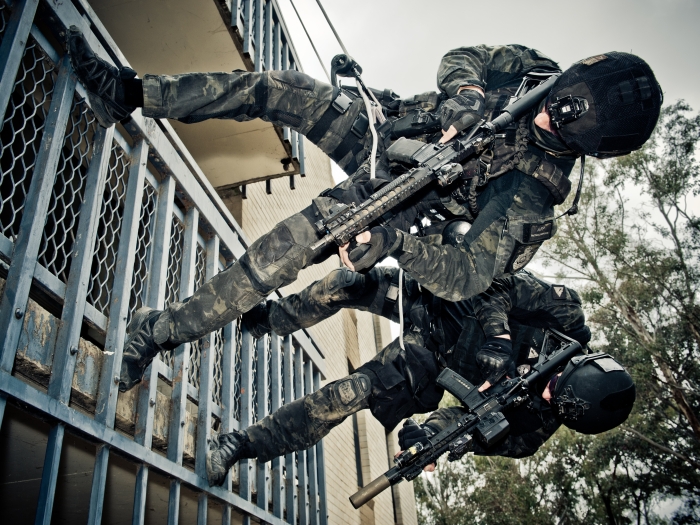 Two AFP TR  officers roping down a building