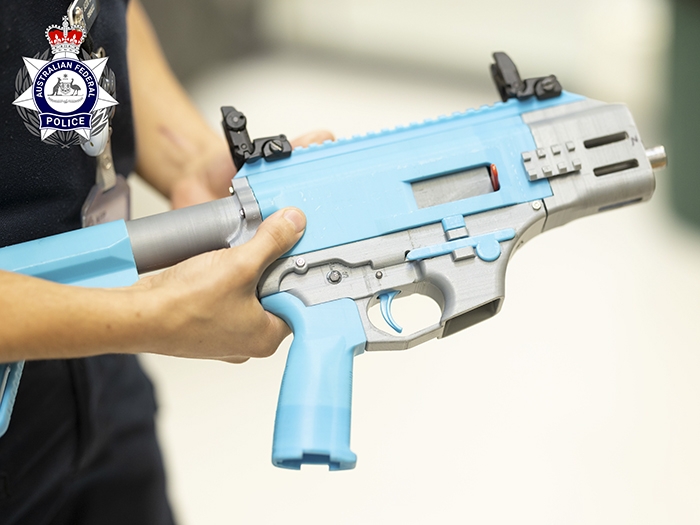 a 3D printed blue and grey firearm