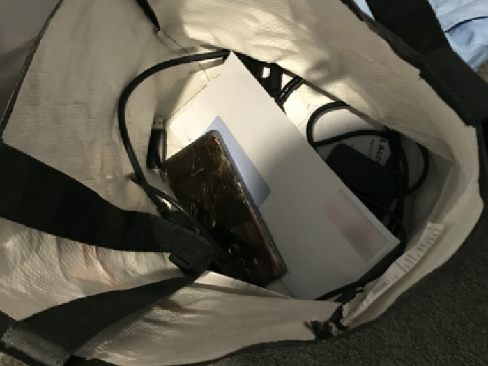 Seized mobile phone in bag
