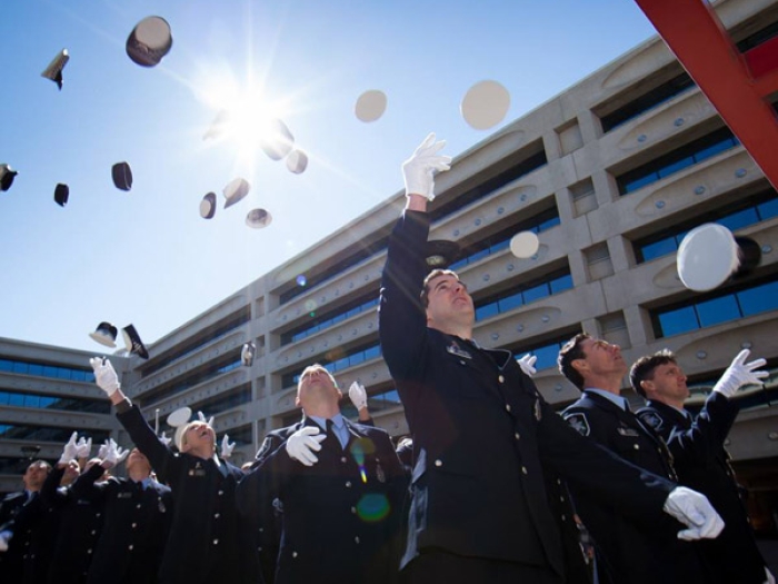 AFP graduates throwing their caps in the air