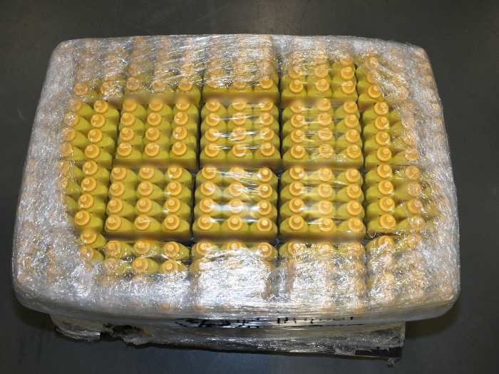 A plastic wrapped crate of mustard bottles containing liquid methamphetamine 