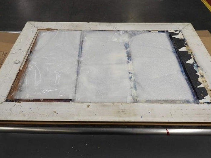 Four kilograms of methamphetamine was found hidden behind a painting sent from Canada