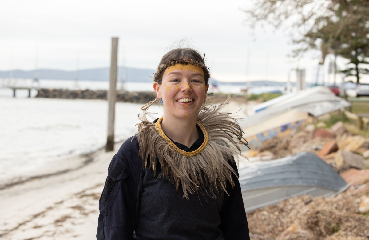 Worimi woman wearing aboriginal artefacts