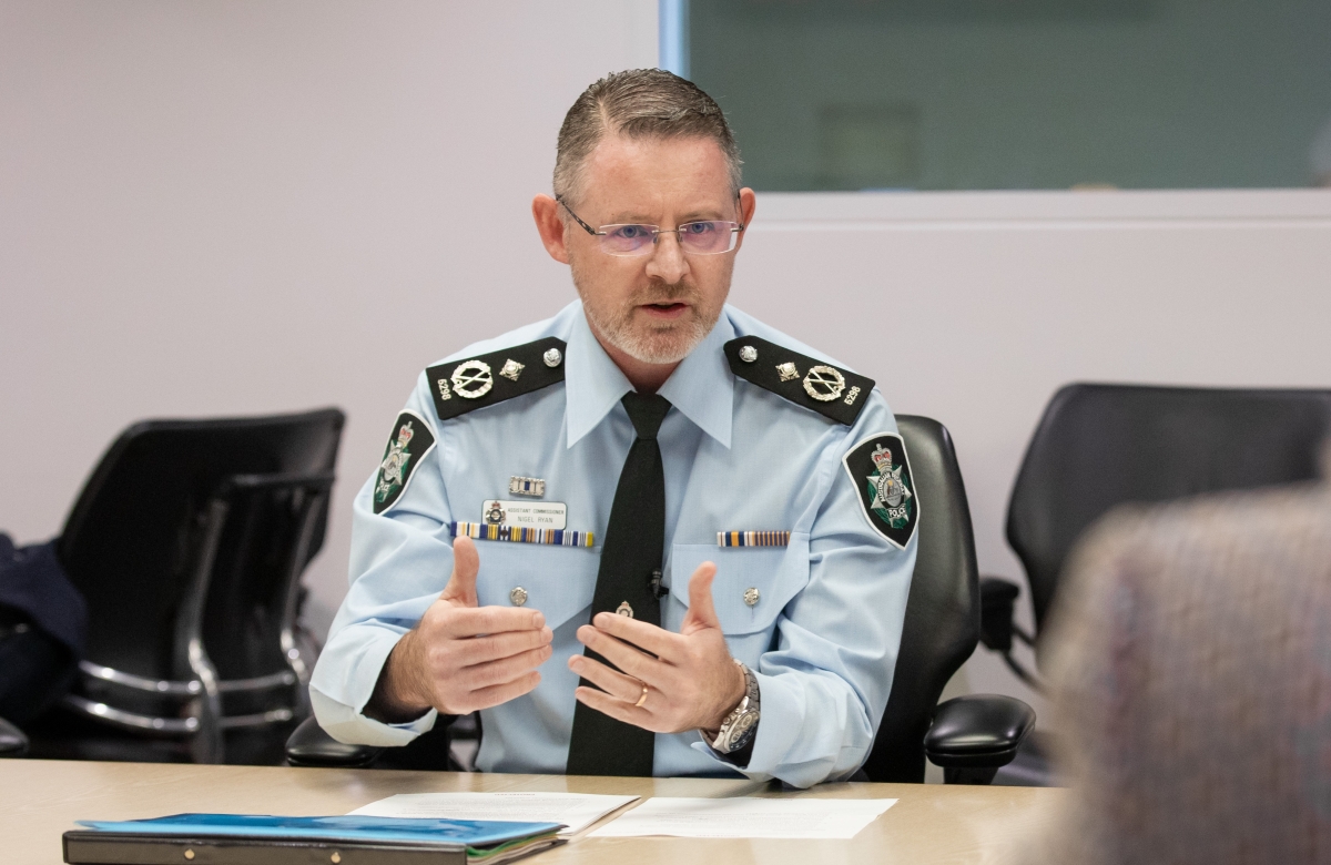 AFP officer speaking in an operational meeting