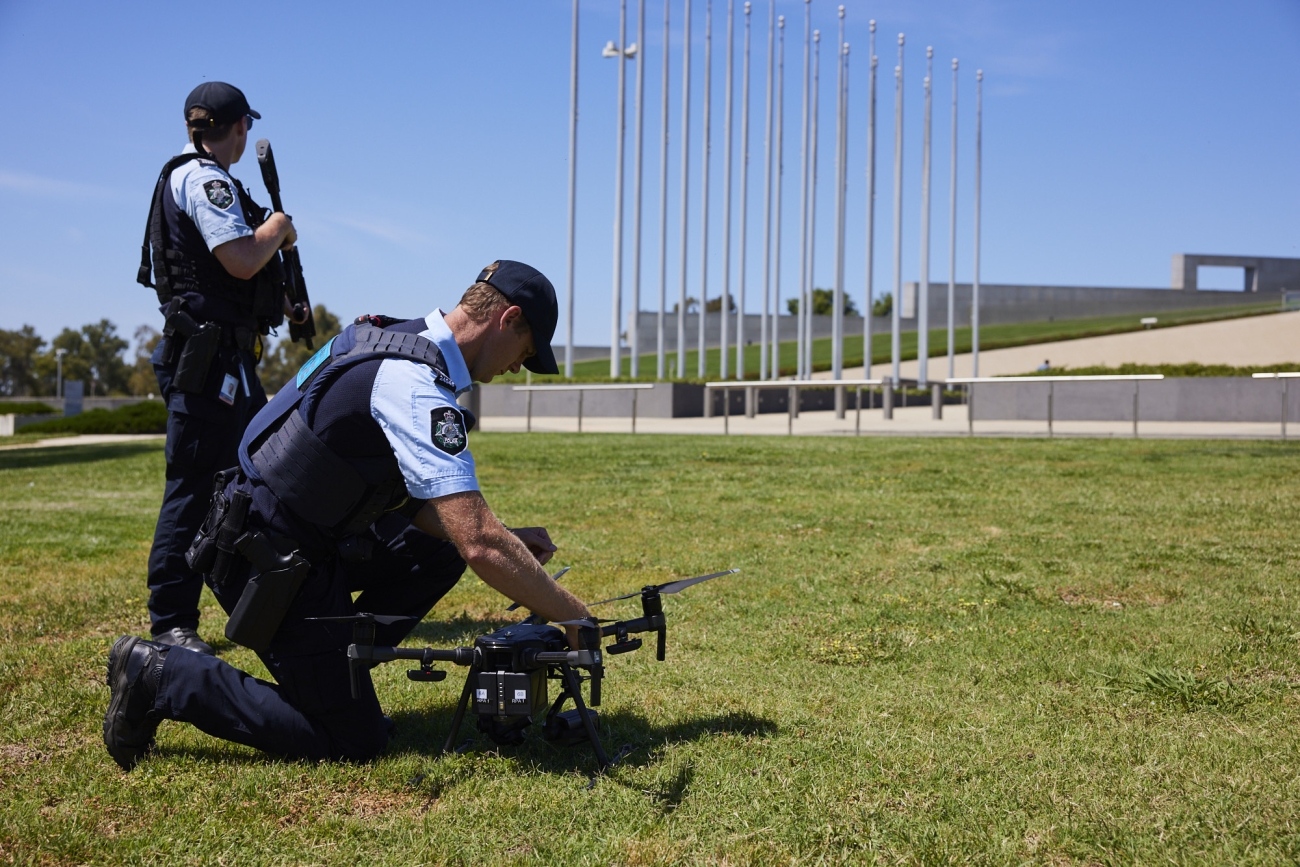 AFP PSO Officers with a drone on the lawns at Parliament House Canberra