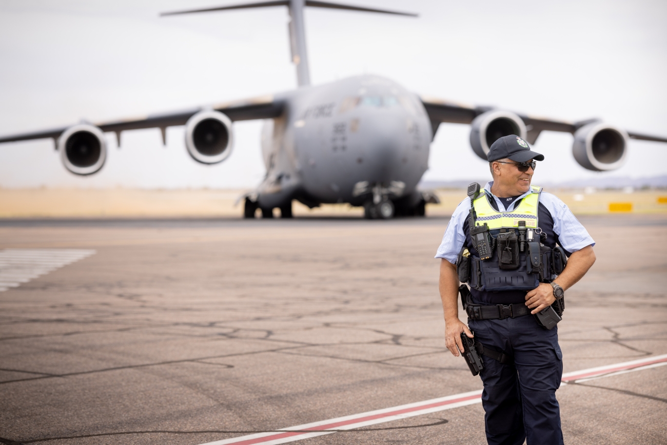 AFP officer near plane