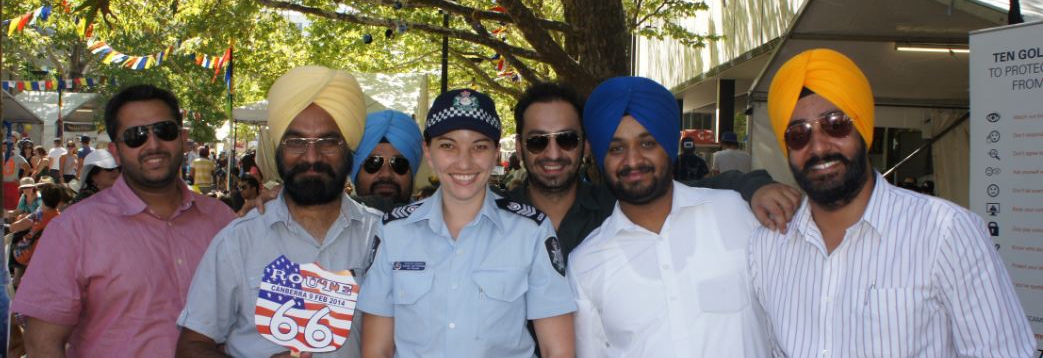 AFP Community Liaison Officer with members of the community