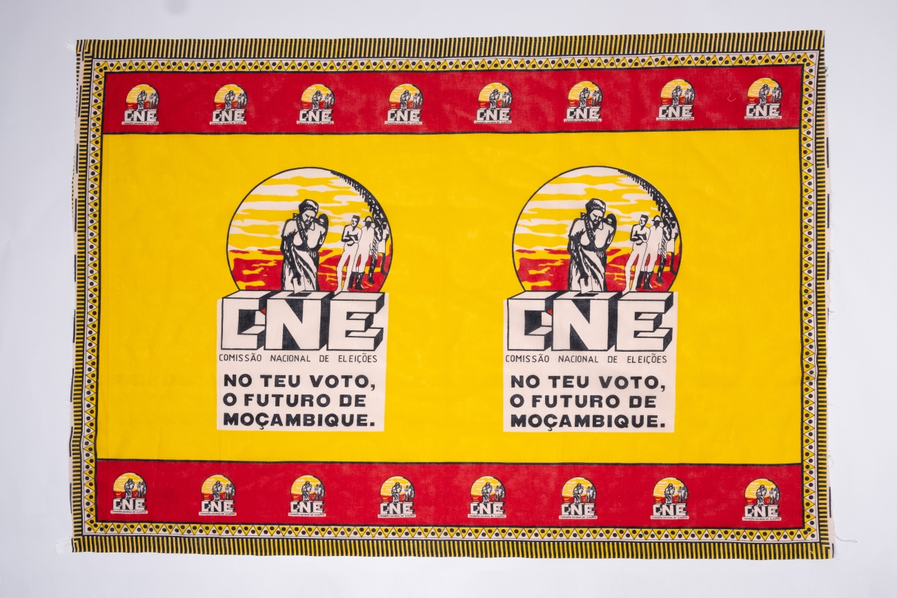 This fabric election banner is reminding residents about the importance of voting for the future of Mozambique.  The Portuguese text on the banner translates to 'National Commission of Elections in your vote and future of Mozambique' (AFPM2103)