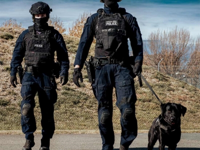Two AFP officers with high-risk explosive detection dog