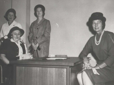 Circa 1957 - Senior Constable Alice Clarke, the first ACT Policewoman, flanked by Constable Joan Coleman (standing left), Constable Robyn Davidson (standing right) and Sergeant Gladys Johnson (seated right) AFPMRN368 