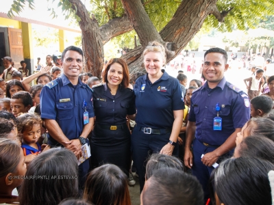 AFP and Timor-Leste officers with children