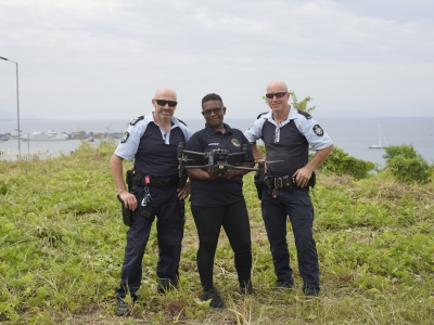 2 AFP police officers with local police officer with drone in the Solomon Islands